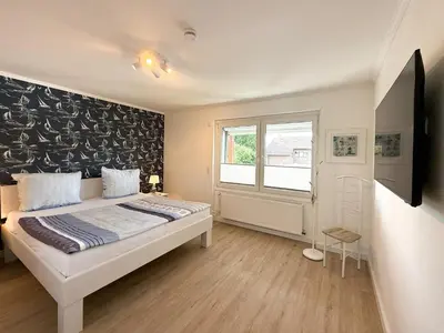 Ein Bett oder Betten in einem Zimmer der Unterkunft Gästehaus Passat