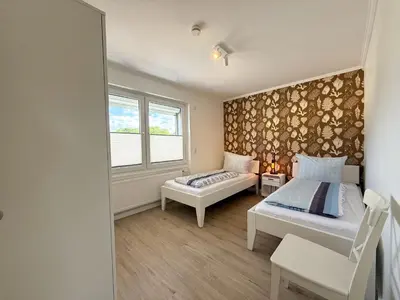 Ein Bett oder Betten in einem Zimmer der Unterkunft Gästehaus Passat