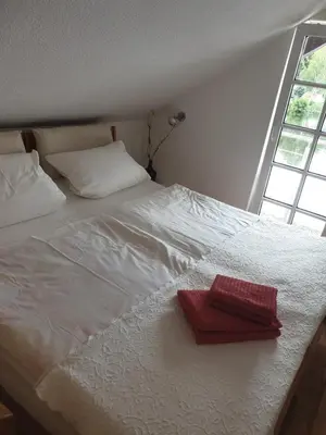 Ein Bett oder Betten in einem Zimmer der Unterkunft Apartment am Stadtsee