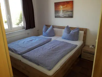 Ein Bett oder Betten in einem Zimmer der Unterkunft Ferienwohnung Berger