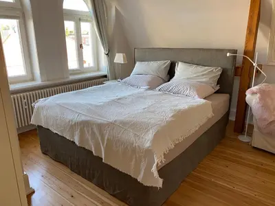 Ein Bett oder Betten in einem Zimmer der Unterkunft Ferienwohnung Bamberger
