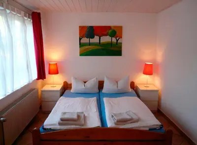 Ein Bett oder Betten in einem Zimmer der Unterkunft Landhaus-Marwede App 4