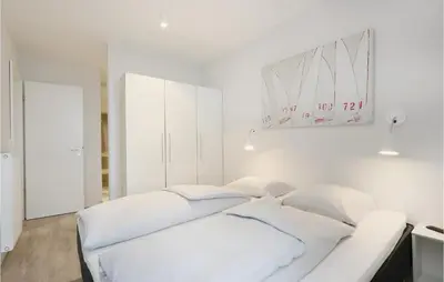 Ein Bett oder Betten in einem Zimmer der Unterkunft Priwallpromenade 1, Whg 5
