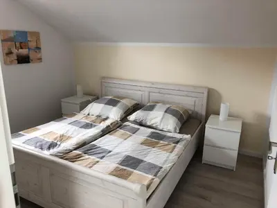Ein Bett oder Betten in einem Zimmer der Unterkunft Ferienwohnung Völker