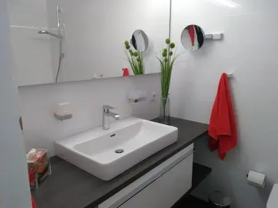 Ein Badezimmer in der Unterkunft Ferienwohnung-Apartment-Seeblick-in-Plaza-Marit-Residenz