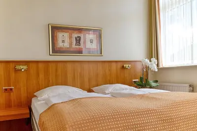 Ein Bett oder Betten in einem Zimmer der Unterkunft Traveller Hotel