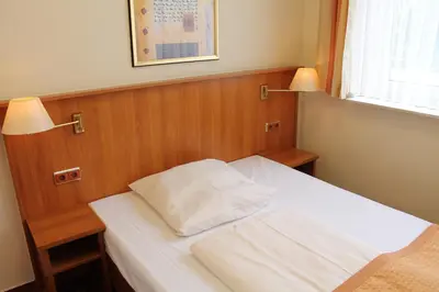 Ein Bett oder Betten in einem Zimmer der Unterkunft Traveller Hotel