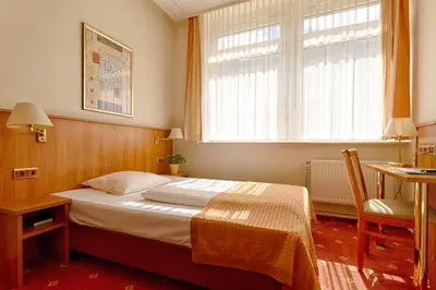 Ein Bett oder Betten in einem Zimmer der Unterkunft Traveller Hotel