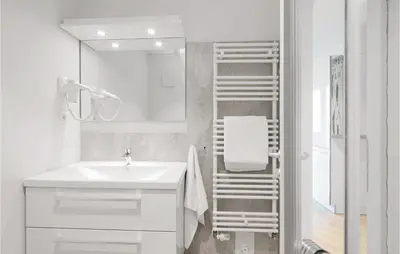 Ein Badezimmer in der Unterkunft Dünenvilla 11, Whg 2