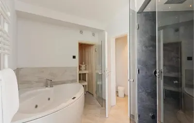 Ein Badezimmer in der Unterkunft Dünenvilla 11, Whg 10