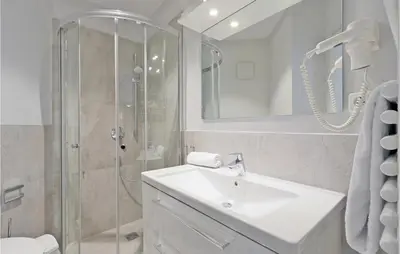 Ein Badezimmer in der Unterkunft Dünenvilla 12, Whg 4