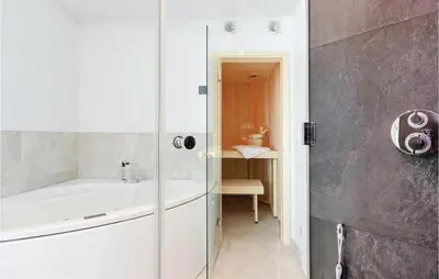 Ein Badezimmer in der Unterkunft Dünenvilla 13, Whg 10