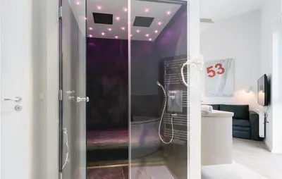 Ein Badezimmer in der Unterkunft Dünenvilla 15, Whg 10