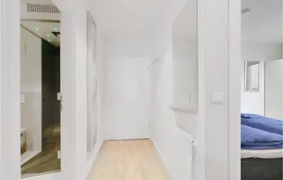 Ein Bett oder Betten in einem Zimmer der Unterkunft Dünenvilla 18, Whg 5