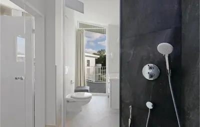 Ein Badezimmer in der Unterkunft Dünenvilla 18, Whg 9