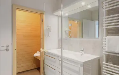 Ein Badezimmer in der Unterkunft Dünenvilla 21, Whg 1