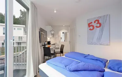 Ein Bett oder Betten in einem Zimmer der Unterkunft Dünenvilla 21, Whg 4
