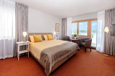 Ein Bett oder Betten in einem Zimmer der Unterkunft Wittlers Hotel