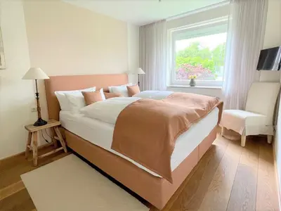 Ein Bett oder Betten in einem Zimmer der Unterkunft Techts Apartmenthaus