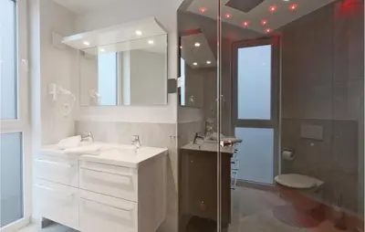 Ein Badezimmer in der Unterkunft Dünenvilla 7, Whg 1