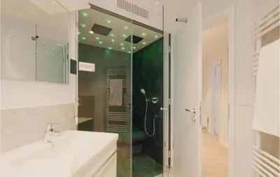 Ein Badezimmer in der Unterkunft Dünenvilla 7, Whg 1