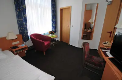 Ein Bett oder Betten in einem Zimmer der Unterkunft Hotel Stadt Reinfeld