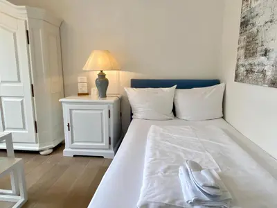 Ein Bett oder Betten in einem Zimmer der Unterkunft Appartement-Hotel Timmendorfer Strand