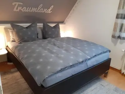 Ein Bett oder Betten in einem Zimmer der Unterkunft Gästehaus Wolf