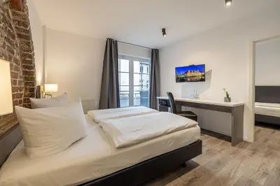 Ein Bett oder Betten in einem Zimmer der Unterkunft Hotel KO15