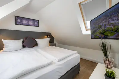 Ein Bett oder Betten in einem Zimmer der Unterkunft Hotel KO15