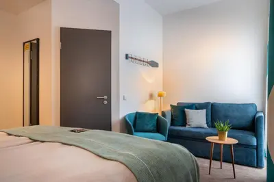 Ein Bett oder Betten in einem Zimmer der Unterkunft Holiday Inn - the niu, Rig Lübeck by IHG
