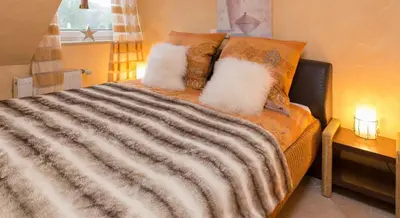 Ein Bett oder Betten in einem Zimmer der Unterkunft Altes Strandhus Casa Strandmuschel