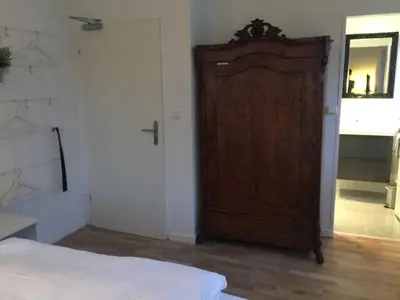 Ein Bett oder Betten in einem Zimmer der Unterkunft Gästehaus Denecke
