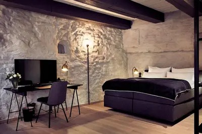 Ein Bett oder Betten in einem Zimmer der Unterkunft Fisher's Loft Hotel