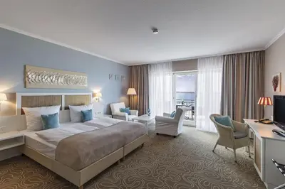 Ein Bett oder Betten in einem Zimmer der Unterkunft Mein Strandhaus - Hotel, Restaurant & Schwimmbad