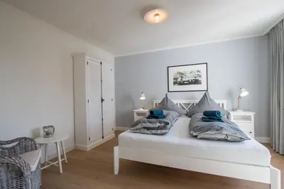 Ein Bett oder Betten in einem Zimmer der Unterkunft Strandhaus Niendorf
