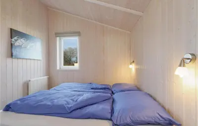 Ein Bett oder Betten in einem Zimmer der Unterkunft Frische Brise 5 - Dorf 2