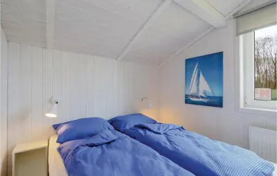 Ein Bett oder Betten in einem Zimmer der Unterkunft Frische Brise 7 - Dorf 2