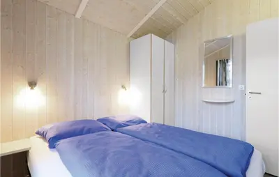 Ein Bett oder Betten in einem Zimmer der Unterkunft Abendrot 12 - Dorf 3