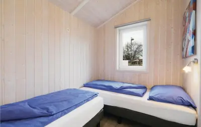 Ein Bett oder Betten in einem Zimmer der Unterkunft Abendrot 9 - Dorf 3