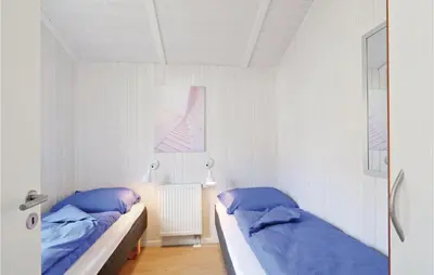 Ein Bett oder Betten in einem Zimmer der Unterkunft Frische Brise 19 - Dorf 3