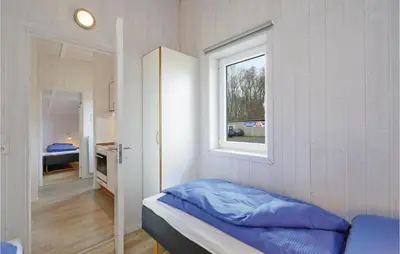 Ein Bett oder Betten in einem Zimmer der Unterkunft Frische Brise 19 - Dorf 3