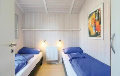 Ein Bett oder Betten in einem Zimmer der Unterkunft Frische Brise 17 - Dorf 3