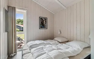 Ein Bett oder Betten in einem Zimmer der Unterkunft Frische Brise 29 - Dorf 3