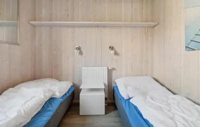 Ein Bett oder Betten in einem Zimmer der Unterkunft Dünenpark 13 - Dorf 6