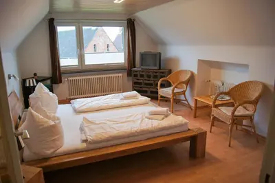 Ein Bett oder Betten in einem Zimmer der Unterkunft Nobis Krug
