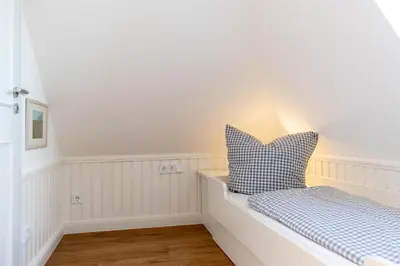 Ein Bett oder Betten in einem Zimmer der Unterkunft Ferienwohnung Villa Susewind 2