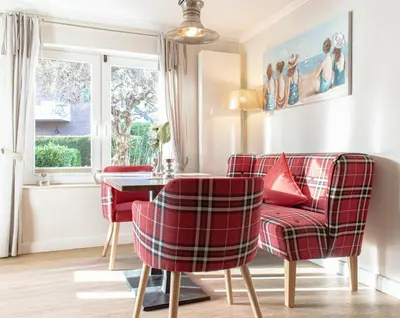 Ein Sitzbereich in der Unterkunft Ferienwohnung Onkel Toms Hütte