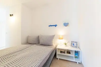 Ein Bett oder Betten in einem Zimmer der Unterkunft Ferienwohnung App. 9 Haus Duckdalben
