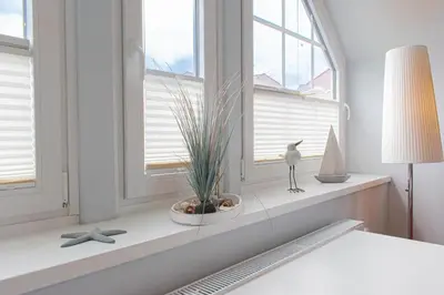 Ein Bett oder Betten in einem Zimmer der Unterkunft Ferienwohnung Dünenmeer